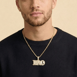Male model wearing CRNCY's Small BRO Photo Pendant with a 14k gold finish and a 20 inch length necklace.
