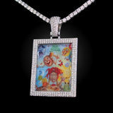 The front side of CRNCY's Large Framed Photo Pendant with a silver finish. The front side features prong-set diamonds around the photo and on the bale. The front side shows the customer's photo choice.