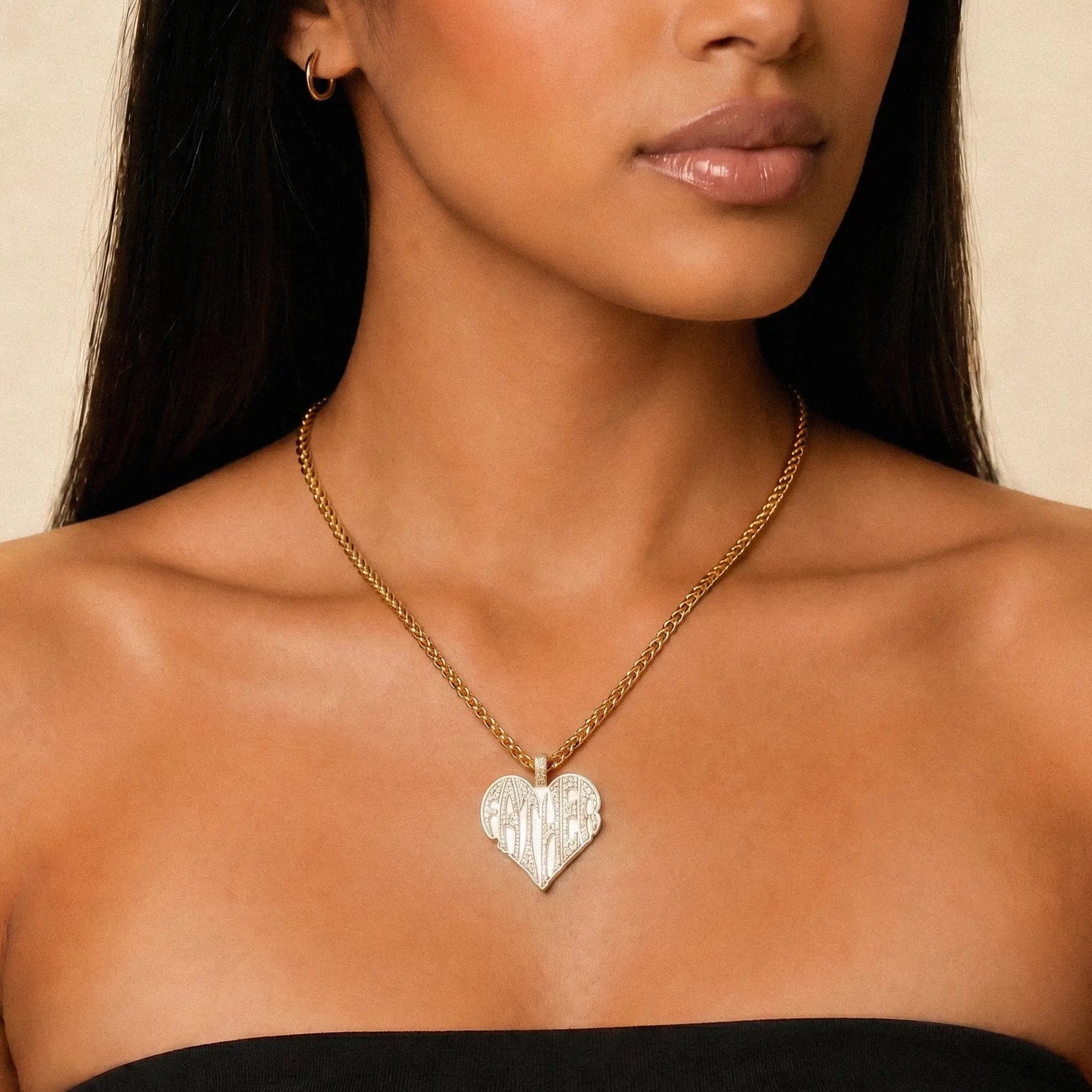 Female model wearing CRNCY's Father Heart Photo Pendant with a 14k gold finish and a 18 inch length necklace.