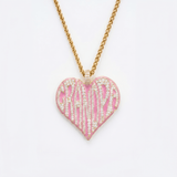 The front side of CRNCY's Grandpa Heart Photo Pendant with a 14k gold finish and pink jewelry enamel. The front side features prong-set diamonds placed inside each letter, surrounded by colored jewelry enamel to outline the letters. 