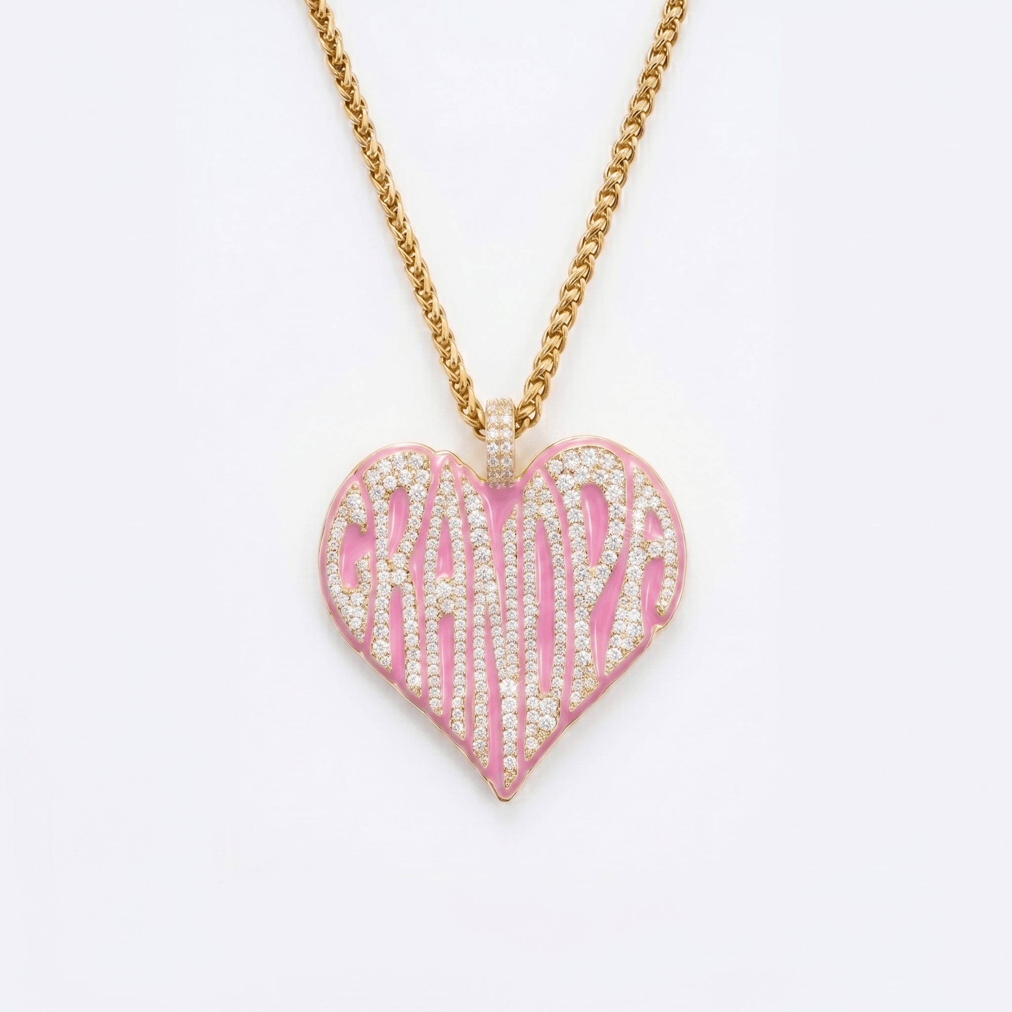 The front side of CRNCY's Grandpa Heart Photo Pendant with a 14k gold finish and pink jewelry enamel. The front side features prong-set diamonds placed inside each letter, surrounded by colored jewelry enamel to outline the letters. 