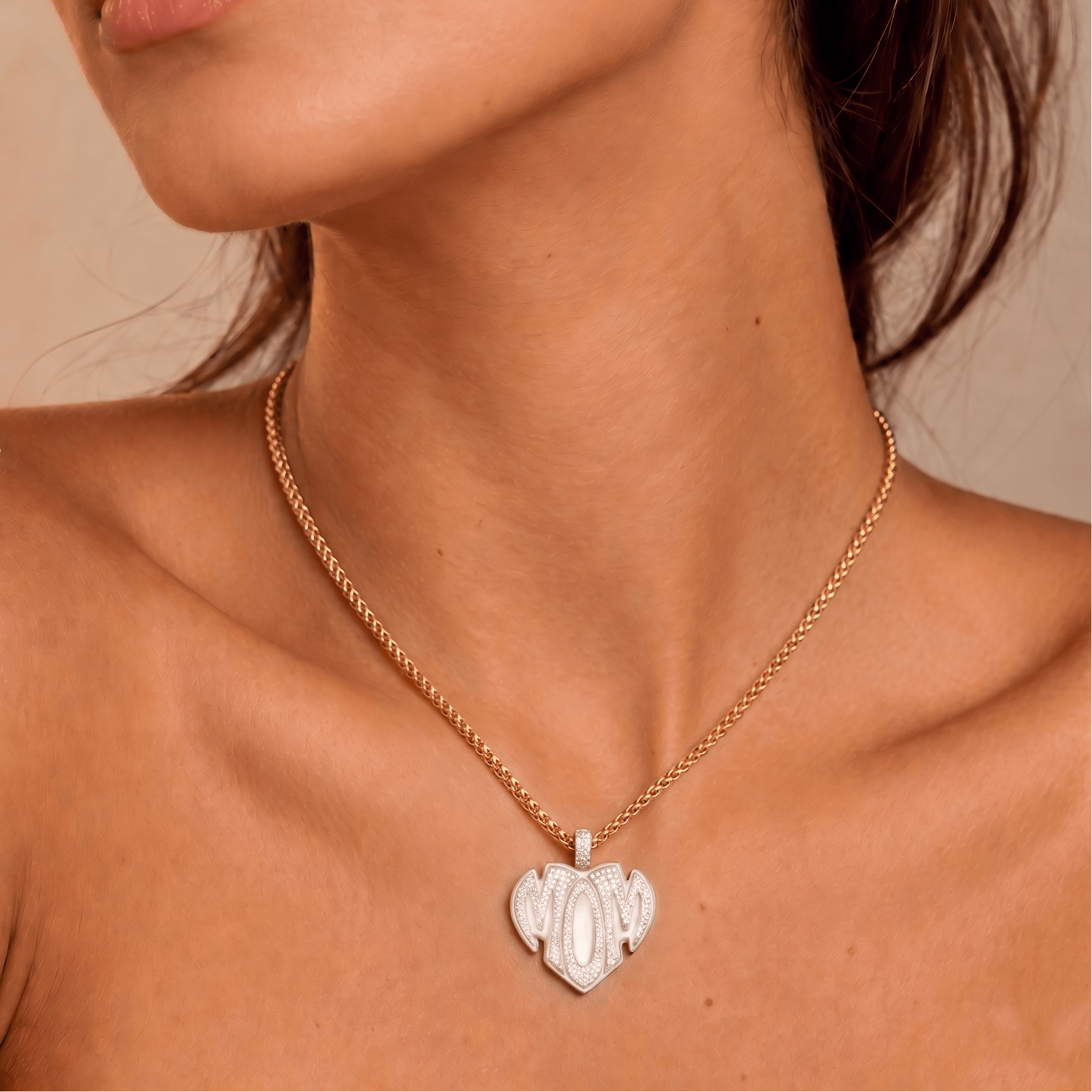 Female model wearing CRNCY's Mom Heart Photo Pendant with a 14k gold finish and a 16 inch length necklace.