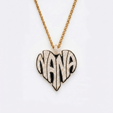 The front side of CRNCY's Nana Heart Photo Pendant with a 14k gold finish and black jewelry enamel. The front side features prong-set diamonds placed inside each letter, surrounded by colored jewelry enamel to outline the letters. 