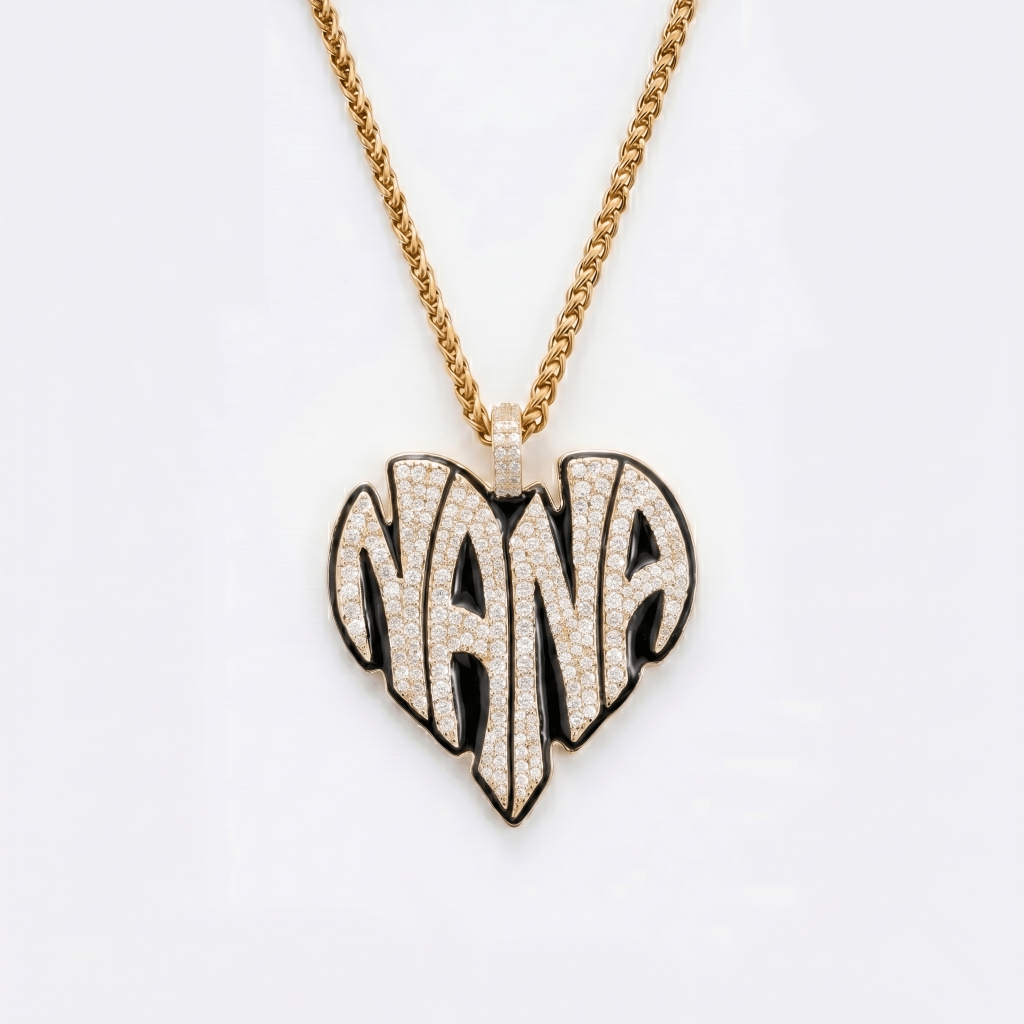 The front side of CRNCY's Nana Heart Photo Pendant with a 14k gold finish and black jewelry enamel. The front side features prong-set diamonds placed inside each letter, surrounded by colored jewelry enamel to outline the letters. 