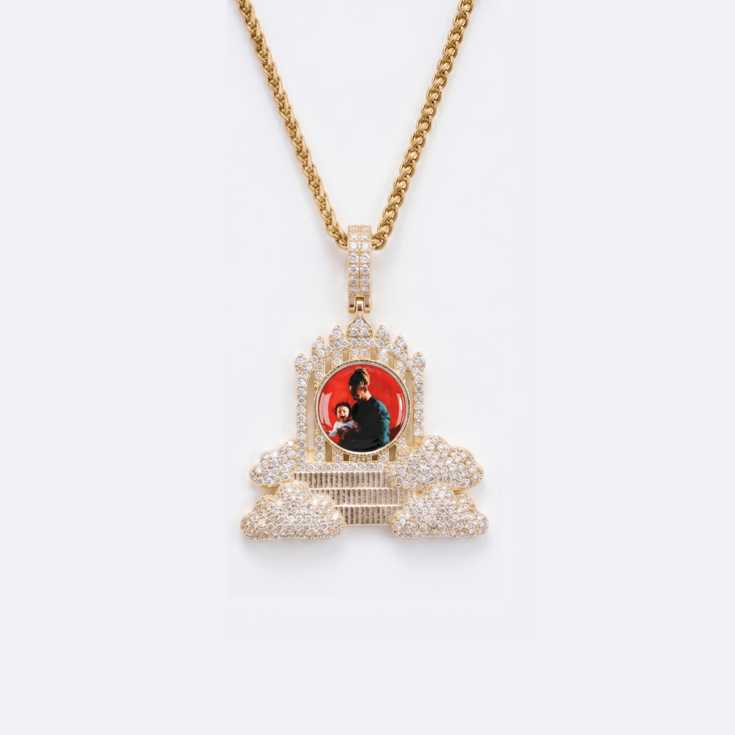 The front side of CRNCY's Regular size Heaven's Gates Photo Pendant with a 14k gold finish. The front side features prong-set diamonds around the photo and on the bale. The front side shows the customer's photo selection.