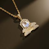 Close-up photo of CRNCY's regular size Heaven's Gates Photo Pendant in a 14k gold finish. The photo illustrates the detail and precision of the photo placement and diamond placement.