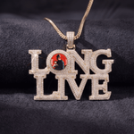 The front side of CRNCY's LONG LIVE Photo Pendant with a 14k gold finish. The front side features prong-set diamonds around the photo, on each letter, and on the bale. The front side shows the customer's photo selection inside the "O" of the "LONG LIVE" name.