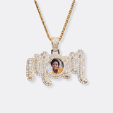 The front side of CRNCY's MOM Photo Pendant with a 14k gold finish. The front side features prong-set diamonds around the photo and on the bale. The front side shows the customer's photo selection.