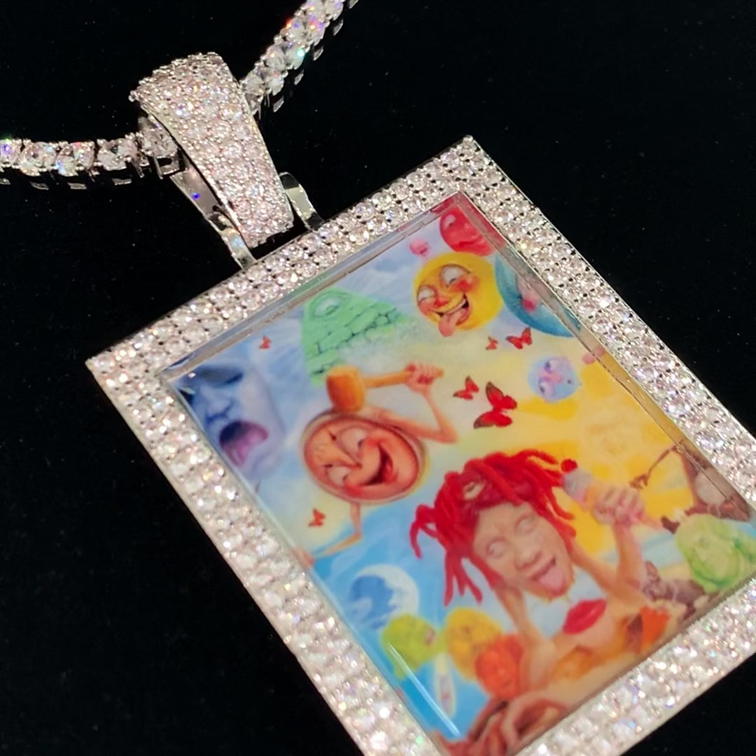 Close-up video of the details of CRNCY's Large Framed Photo Pendant, with a silver finish.