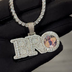 Close up video of CRNCY's small sized BRO Photo Pendant with a silver finish. The video showcases the pendant's details and diamond clarity.