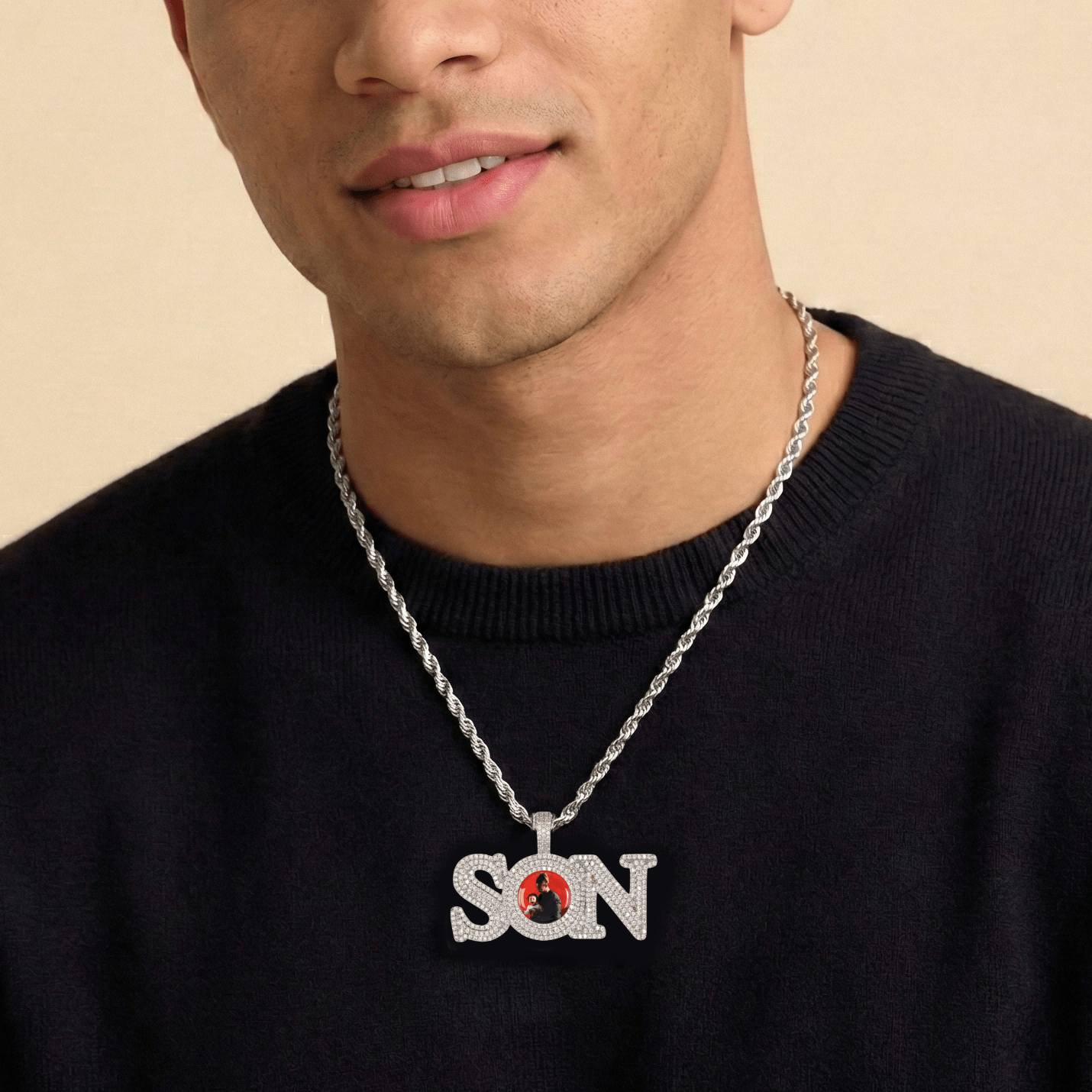 Male model wearing CRNCY's SON Photo Pendant with a silver finish and a 20 inch length necklace.