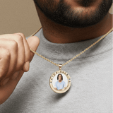 Male model wearing CRNCY's Watch Over Me Photo Pendant with a 14k Gold Finish, with a 18 inch length necklace.